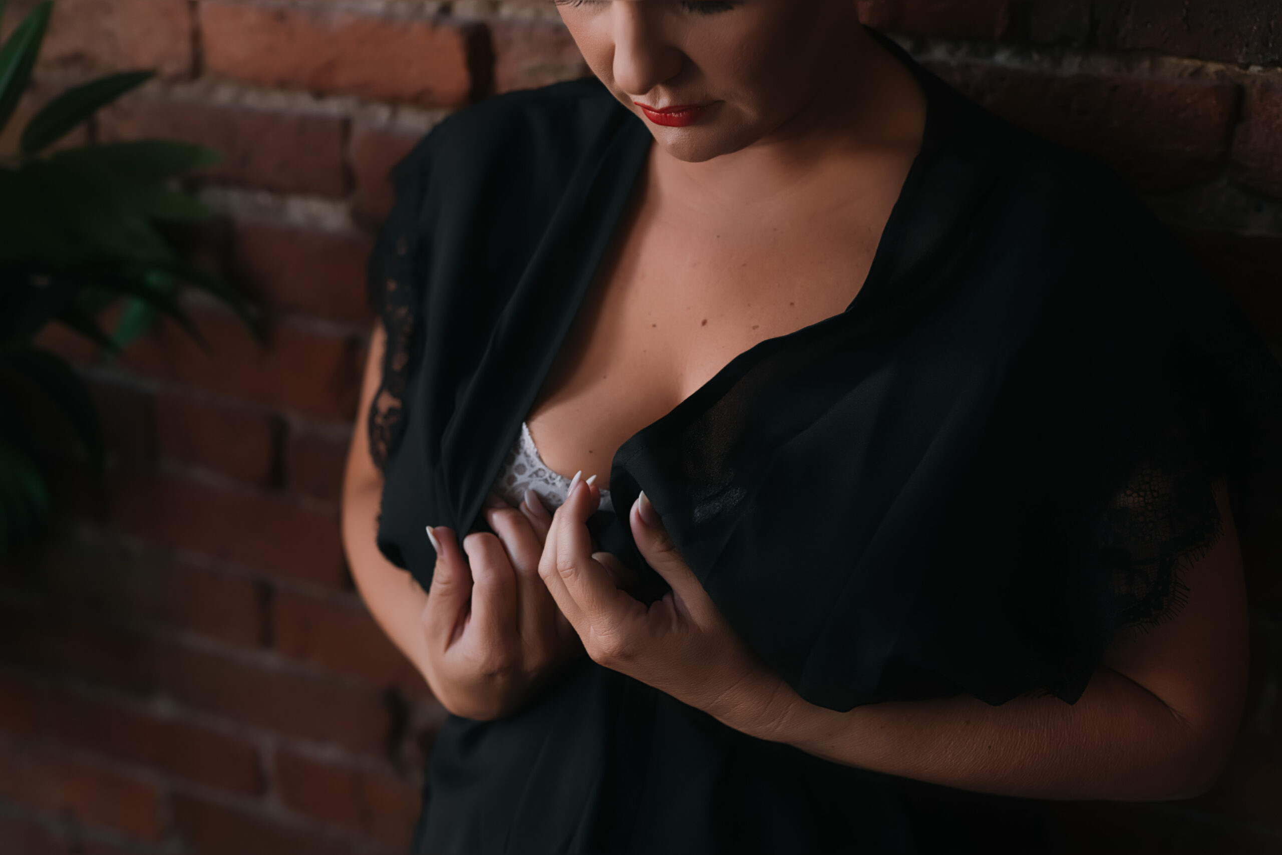 lady in black robe with with white nails