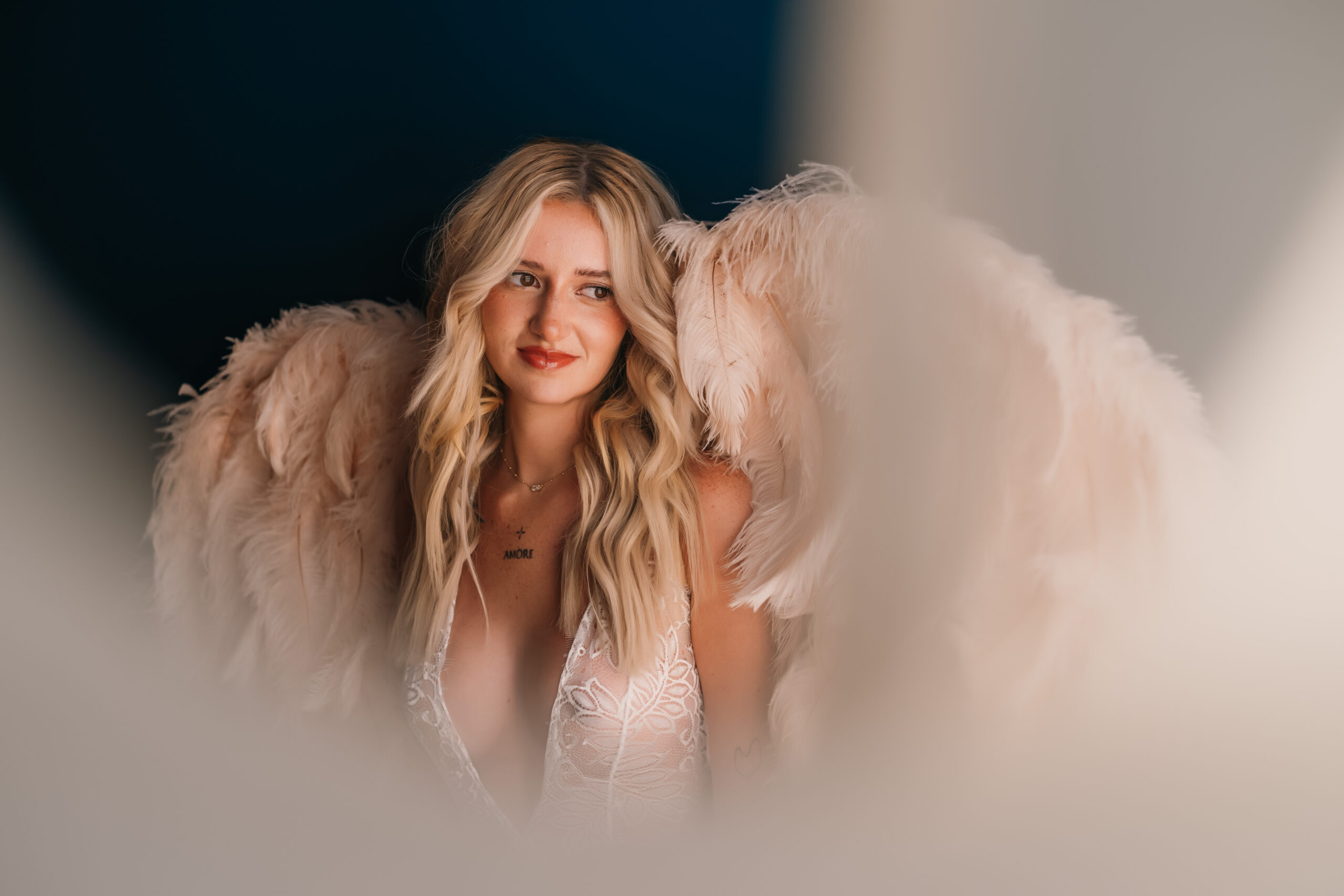 girl with blonde hair and pink wings